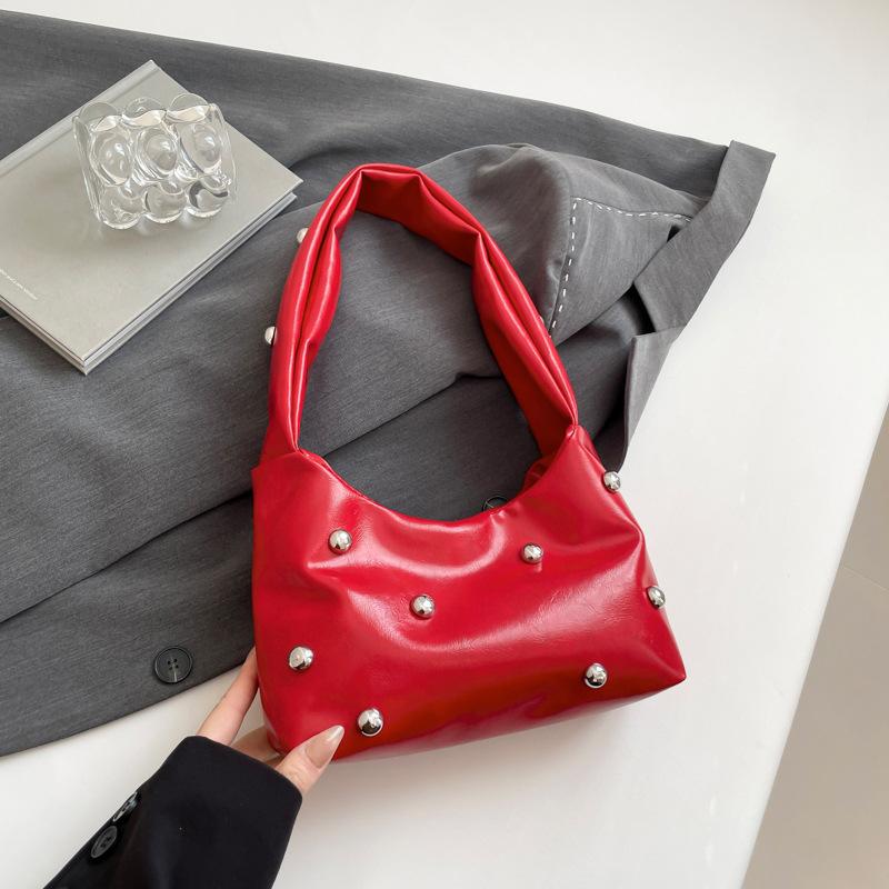 Vintage premium sense crowdsourcing bag women's 2025 spring new rivet shoulder handbag women's commuter armpit bag