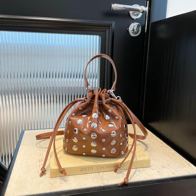 

Punk style rivet messenger bag women s new summer fashion locomotive style shoulder dumpling bag коричневый