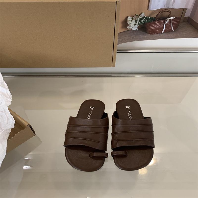 Spring and summer women's outer wear Roman women's shoes one-word seaside beach sandals design sense niche flat-bottomed pinch slippers