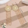 Ethnic Style Tassel Earrings with Hollow Flower Design