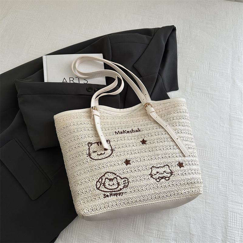 

Woven fashionable large-capacity cat embroidery tote bag, new trendy foreign style, casual commuting temperament, simple beach bag