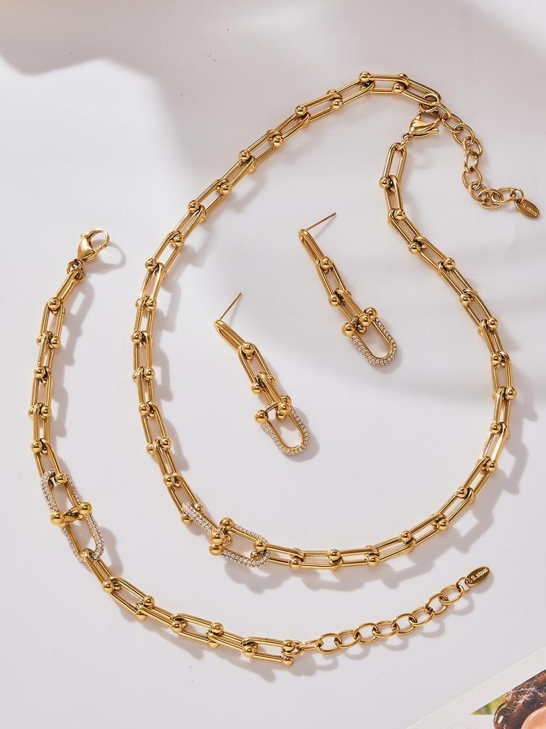 Qiong Yao U-förmiges vergoldetes Edelstahl-Schmuckset: Zirkonia Ohrringe, Halskette & Armband.