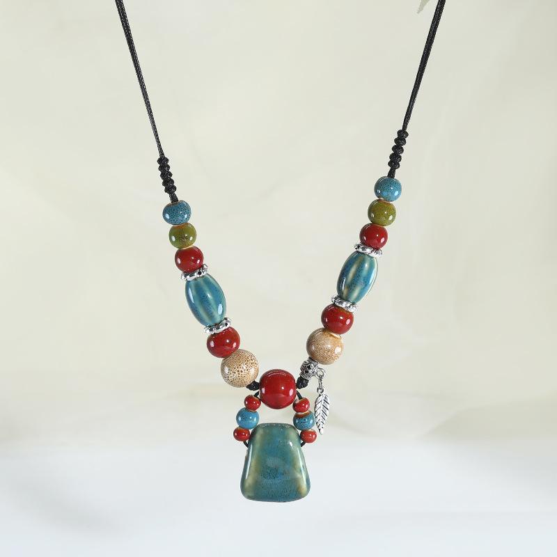 Ceramic axe pendant, long necklace, retro simple and versatile sweater chain.