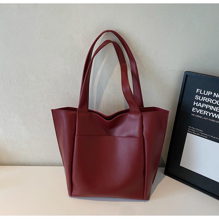 

2025 однотонная нишевая сумка-тоут на плечо, весенняя новая сумочка, модная простая атмосферная сумка-ведро с высоким чувством стиля