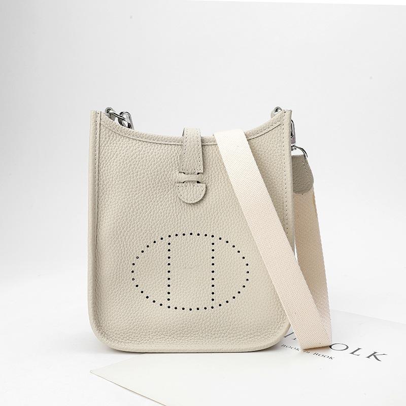 Factory wholesale first layer togo cowhide bucket bag women's bag lychee pattern hollow single shoulder crossbody bag hollow design