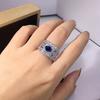 Huitan Funkelnde Damenringe mit ovalem blauem Zirkonia Breiter Ring Wunderschöne Hochzeitsaccessoires Farbe Silber Strahlender Modeschmuck