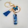 1pc Custom Blue Alphabet Letter Keychain with Butterfly Pendant Resin Ladies Key Ring with Tassel - Elegant Accessory for Bags Backpacks