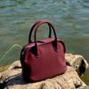Niche high-end sense first layer cowhide pleated portable women European and American temperament versatile large capacity messenger shell bag