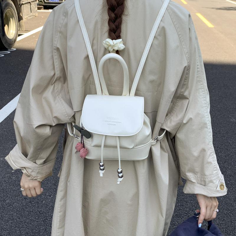

Mini backpack, women s niche design, high-end backpack, trendy Korean version, bucket bag, fashionable and versatile shoulder bag. no pendant белый