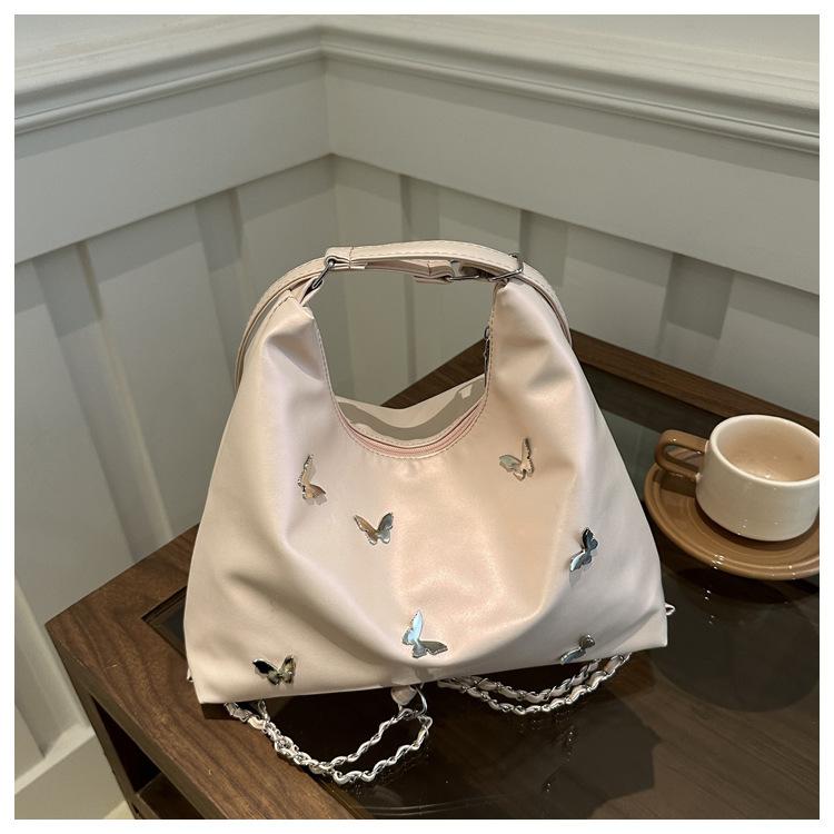 

Casual shoulder large capacity solid color 2025 new summer butterfly fashion commuting single shoulder underarm crossbody bag розовый