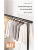 Floor Standing Clothes Rack and Coat Stand with Folding Single Pole for Bedroom or Dormitory.