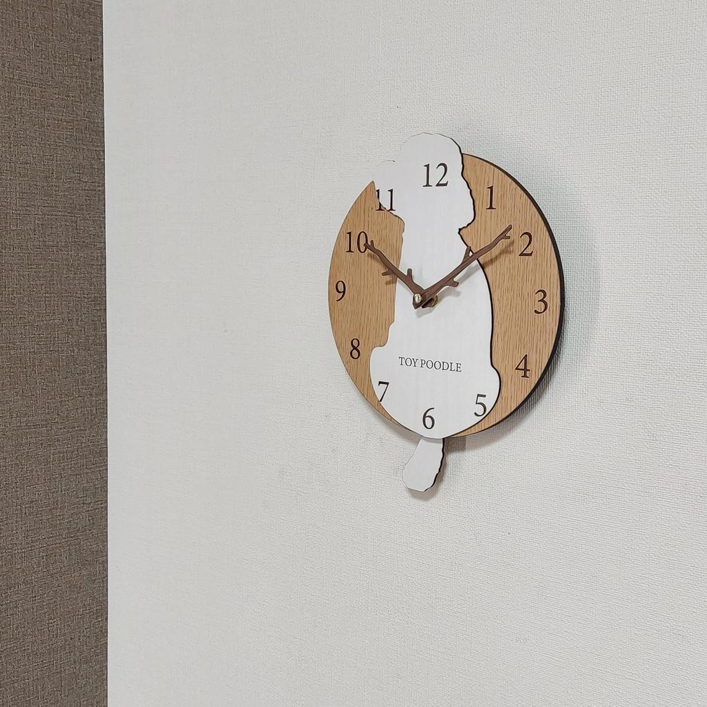 Stylish wooden pendulum clock featuring a toy poodle in white and cream. Silent, perfect for bedrooms, bedrooms, or any room.