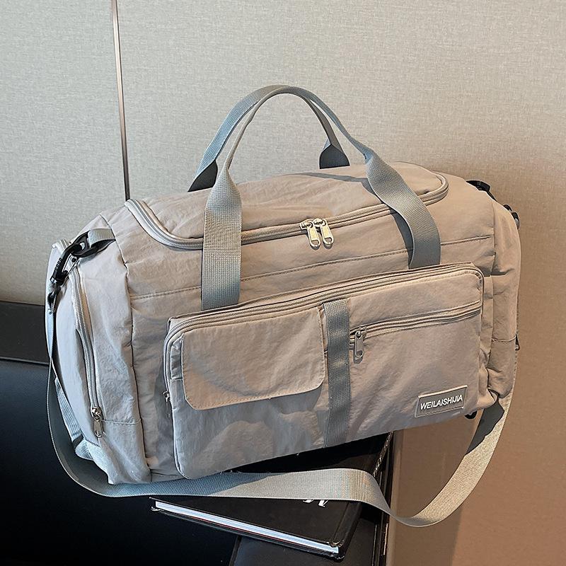 

Large Capacity Waterproof Lightweight Travel Bag for Men and Women - Fashionable Handheld Storage for Short Trips and Sports. 50cm x 24cm x 26cm синий