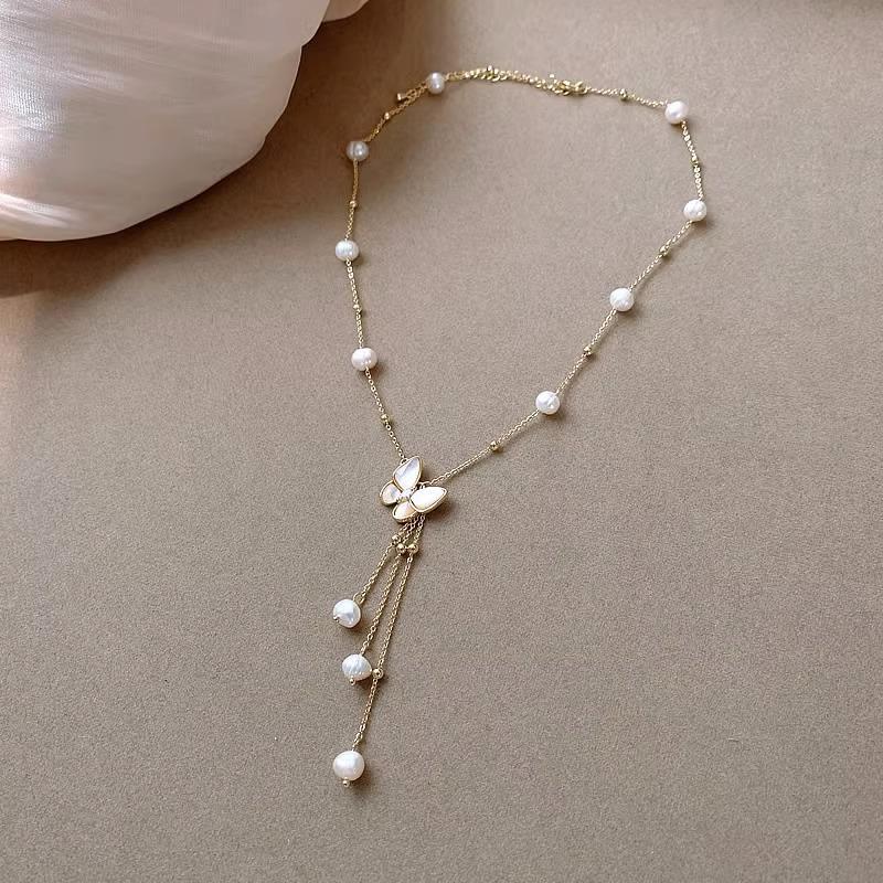 

Ожерелье-кисточка «Бабочка» из титановой стали с пресноводным жемчугом и перламутром