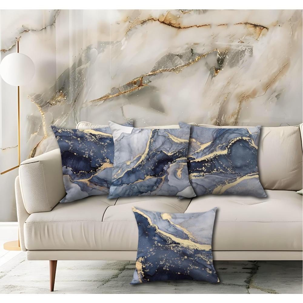 A Set of Four Blue And Golden Pillow Covers Featuring Modern Abstract Marble Patterns, Perfect for Artistic Home Decor in The Bedroom. Each Pillow Cov