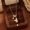 Xiaohongshu Bestseller: Gold Hollow Four-Leaf Clover Necklace - Elegant, Unique Design, Versatile Sweater Chain.