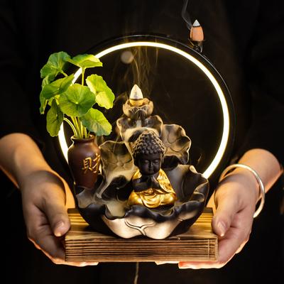 Leichter Luxus Neuer Buddha-Hand-Rückfluss-Weihrauchbrenner LED-Lampenring Heimdekoration Lila Sand Zen-Weihrauchbrenner Weihrauchtisch