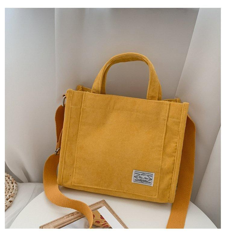

2026 new solid color simple and versatile fashi striped corduroy canvas bag women s shoulder messenger handbag Korean versi жовтий