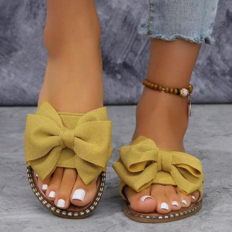 Foreign trade new flat-bottomed rhinestone bow one-word slippers women wear solid color light cloth cool slippers 2025