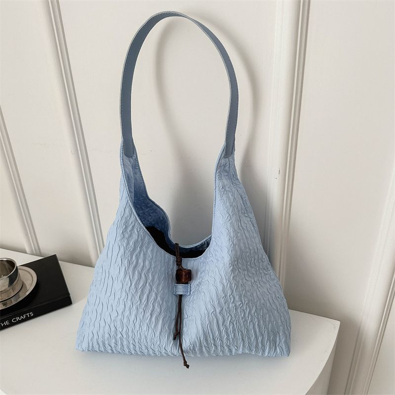 

High-value girl gentle wind large-capacity armpit bag women s 2025 summer new Korean version of bubble pleated shoulder bag синій