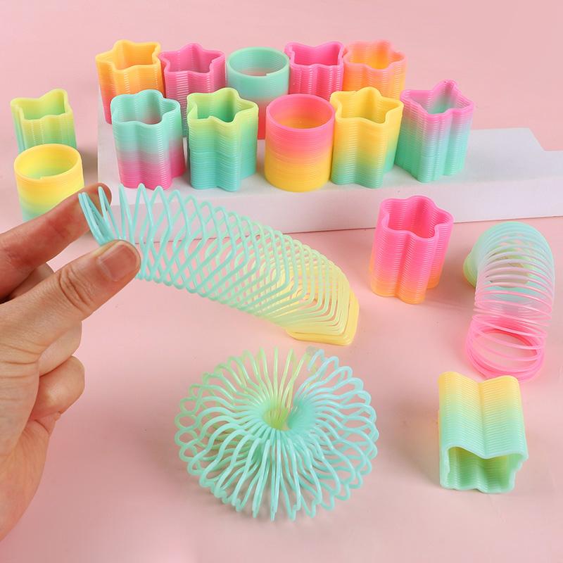 12/24 Stück Regenbogen Magische Feder Hüpfspielzeug Kindergeburtstag Mitgebsel Goodie Piñata Füller Fidget Spielzeug Kreative Weihnachtsgeschenke