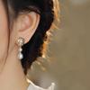 Natural freshwater camellia pearl stud earrings women's niche hollow design sense S925 silver needle simple Korean long earrings