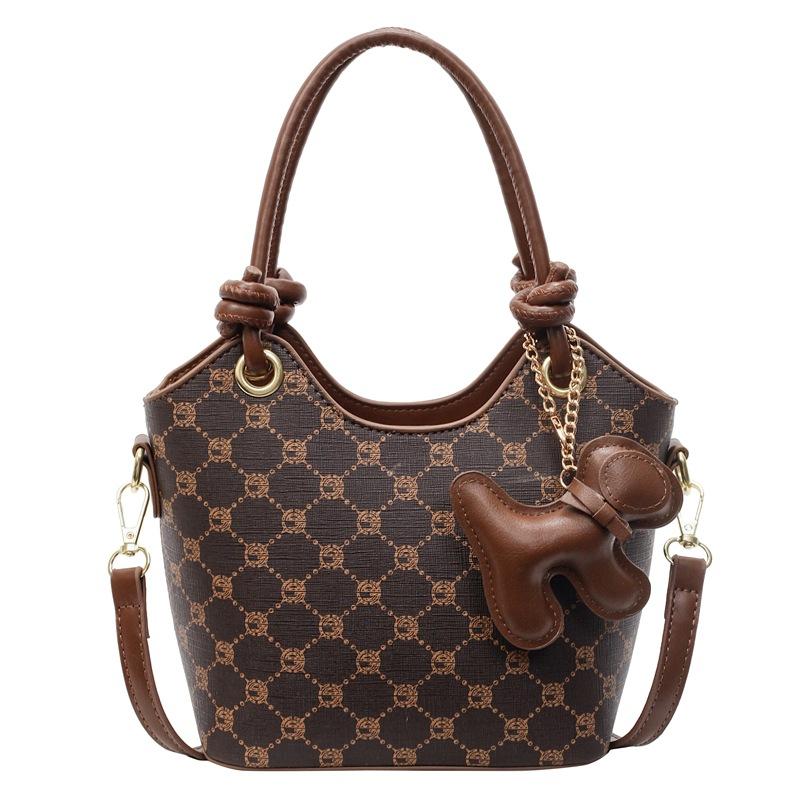 Korean version of trend, high-end printing temperament, portable bucket bag, niche fashion commuting versatile light luxury messenger bag, women