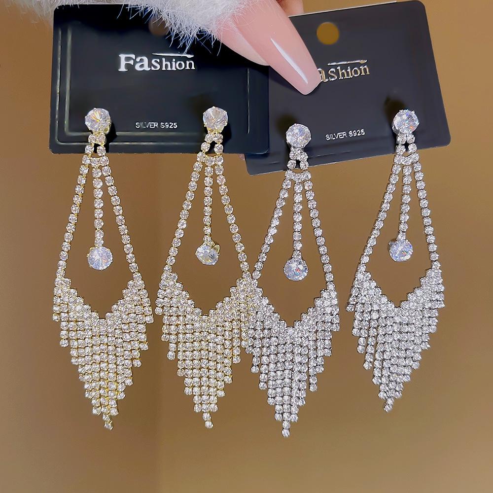 

S925 Silver Needle Diamond Water Drop Stud Earrings with Tassels - High-End European and American Retro Fashion for Women.