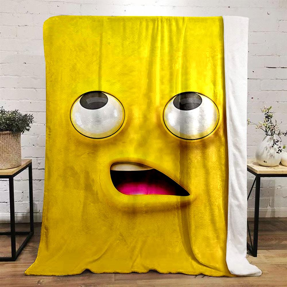 Bright yellow cartoon face with large eyes and an open mouth showing pink. for all seasons blanket lunch break throw gift