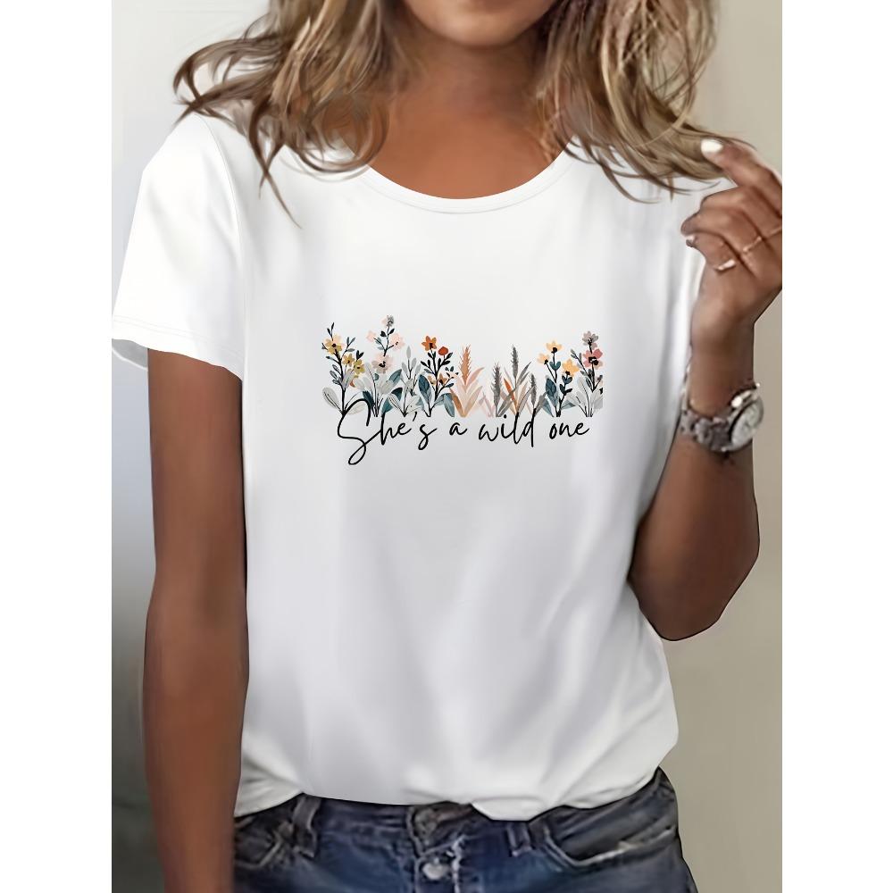 Women's Casual Short Sleeved Round Neck T-shirt with Vibrant Blue Floral Print Featuring "She's Wild At Heart" Reference To Women's T-shirt