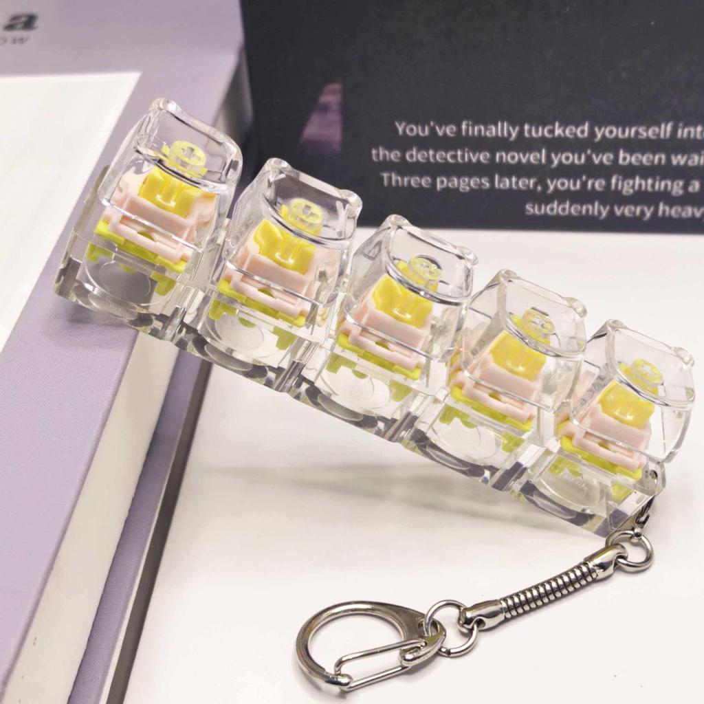 Stummer mechanischer Tastatur-Schlüsselanhänger mit 5,6 Kreuzachsen-Tasten und hochtransparenten Tastenkappen; Dekompression Spielzeug.