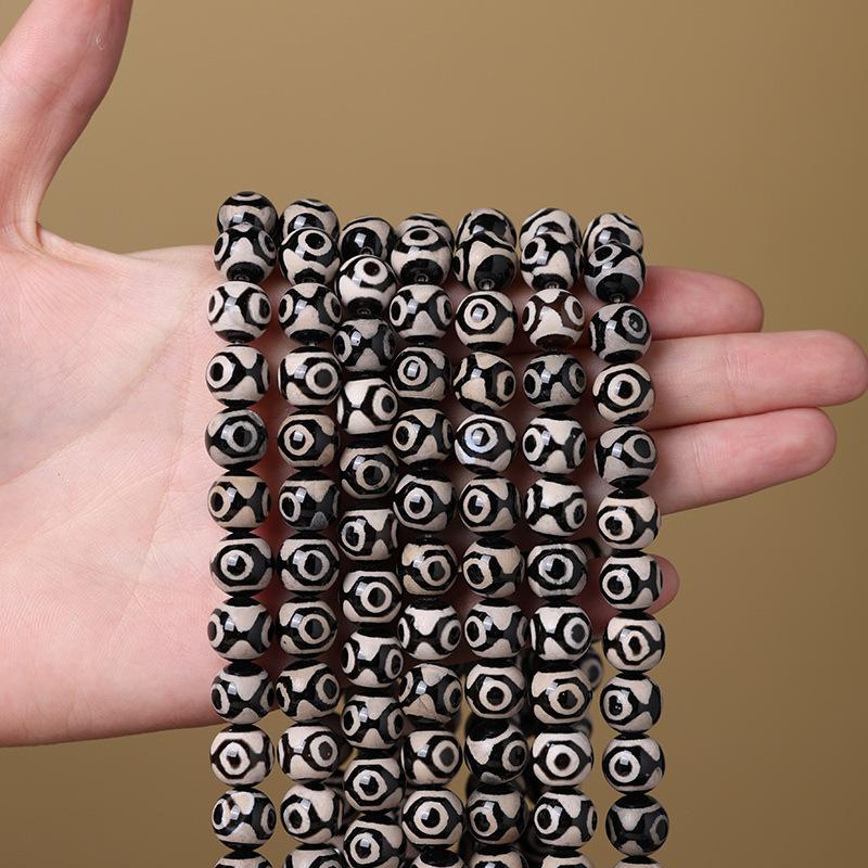 

Agate Three-Eyed Dzi Bead Accessories Loose Beads DIY Beaded bracelets, Buddhist beads, prayer beads, bracelets, pendants, and accessories Black three-eye agate bea