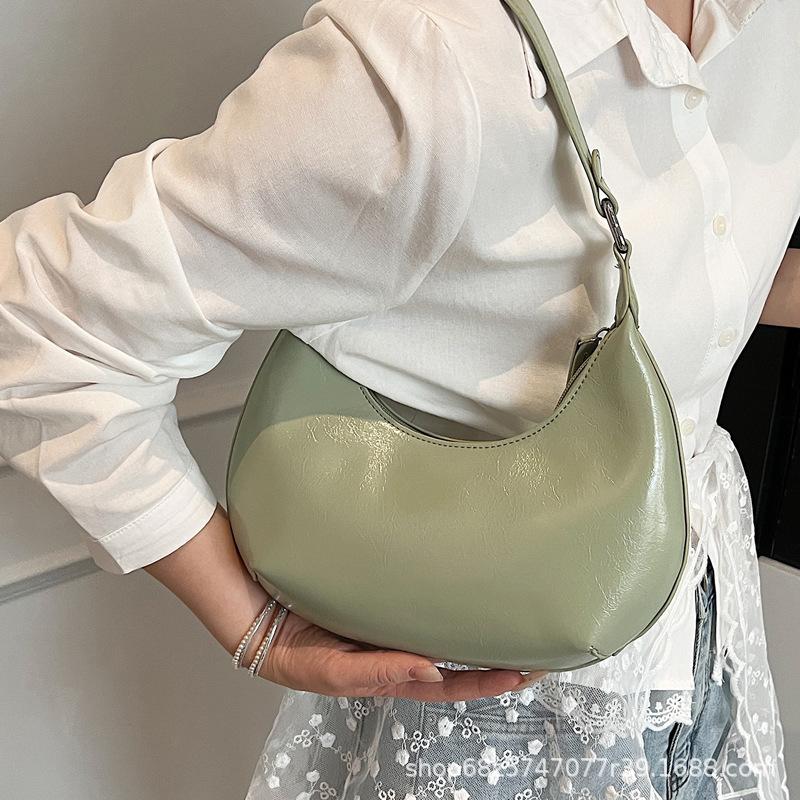 Small bag trend 2025 new fashion handbag high sense versatile women's bag single shoulder solid color half moon armpit bag