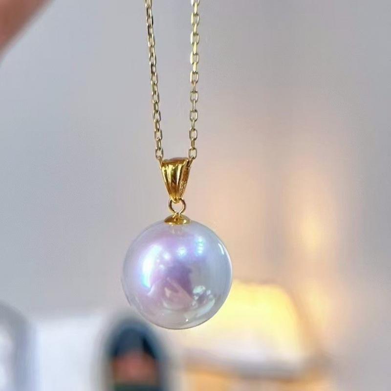

Aurora Freshwater Pearl Necklace: 10-11mm Perfectly Round Pearls with 18K Gold Pendant & Silver Chain.
