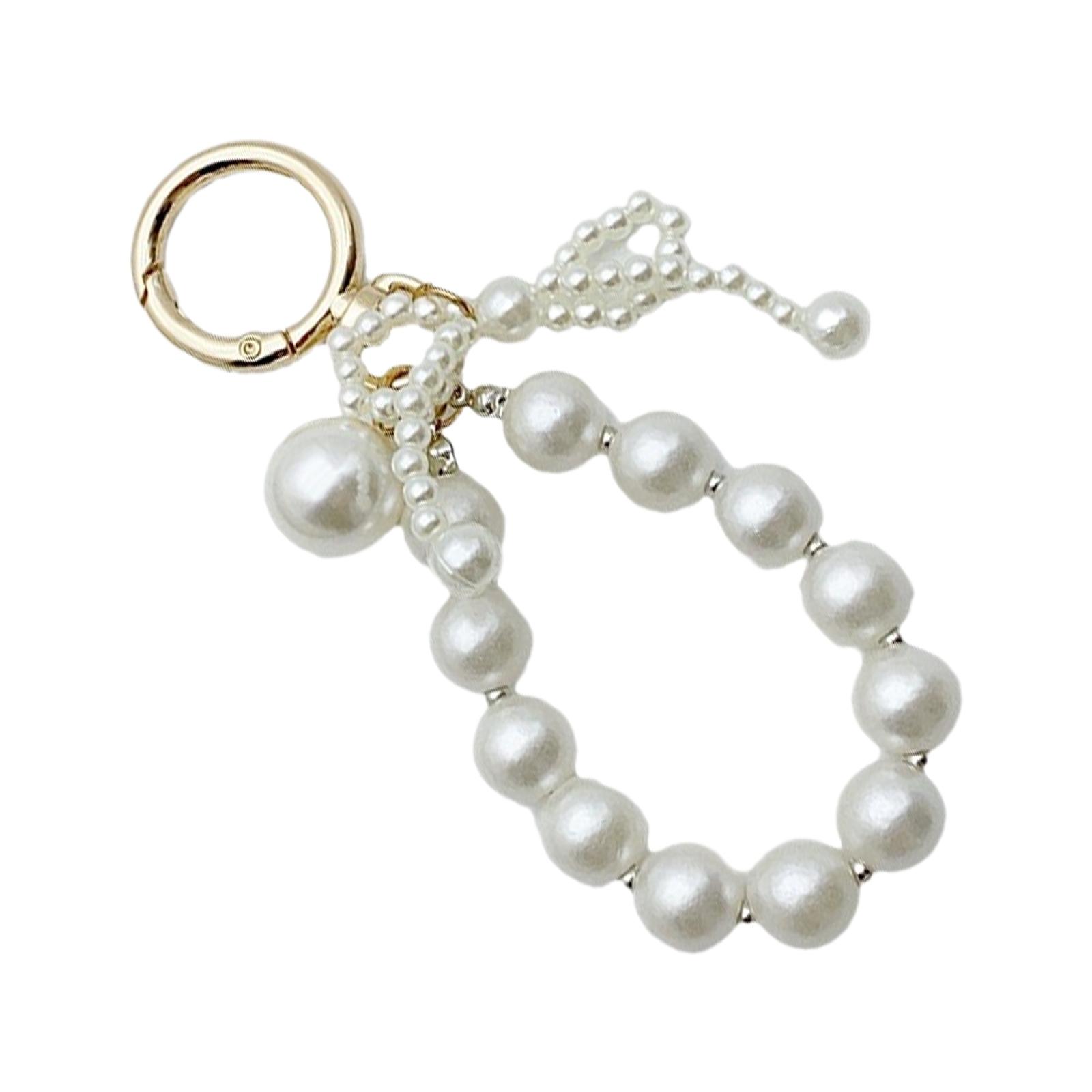 Стильный брелок-бантик с искусственным жемчугом — фото 9