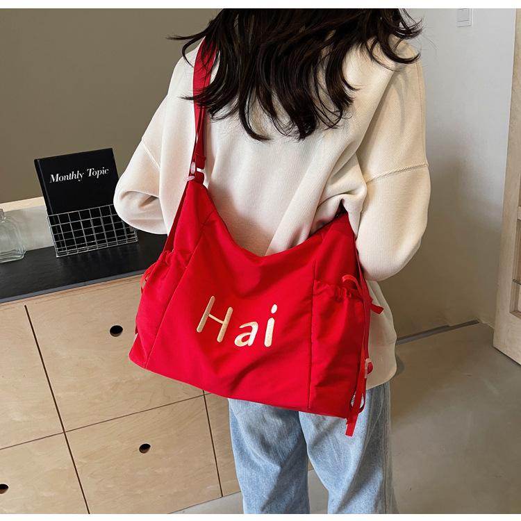 Tote bag women's 2024 new large-capacity commuting letter foreign feeling college students commute to class shoulder backpack