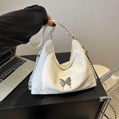 Günlük yumuşak yüzlü büyük kapasiteli kadın sırt çantası 2025 yeni sırt çantası moda nakış kelebek basit omuz büzgü çantası