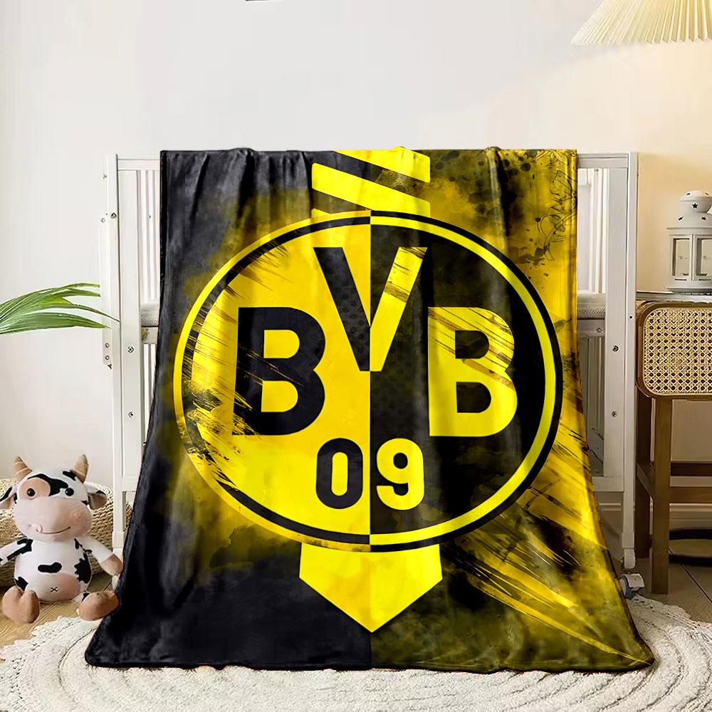 

A two-toned yellow and black circular emblem with bold BVB 09 text. for all seasons blanket lunch break throw gift 80cm x 120cm