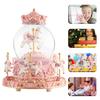 Snow globe music box with colored LED lights, merry-go-round, crystal ball, and automatic snowfall. Popular as a birthday or Christmas gift for girls,