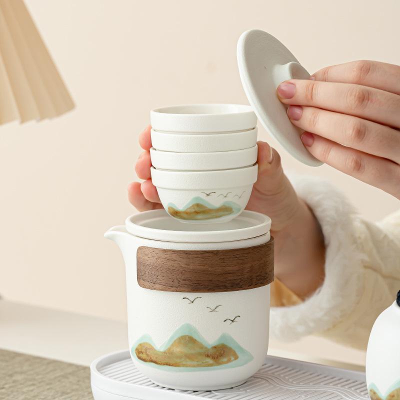 The whole set of creative ceramics, coarse pottery travel kung fu tea set, one pot and four cups, easy to store, office meeting and giving gifts