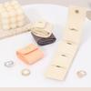 Compact Travel Jewelry Storage Case with a Folding Pouch Design, Separate Storage Spaces, and Snap-Fastened Flap for Small Jewelry