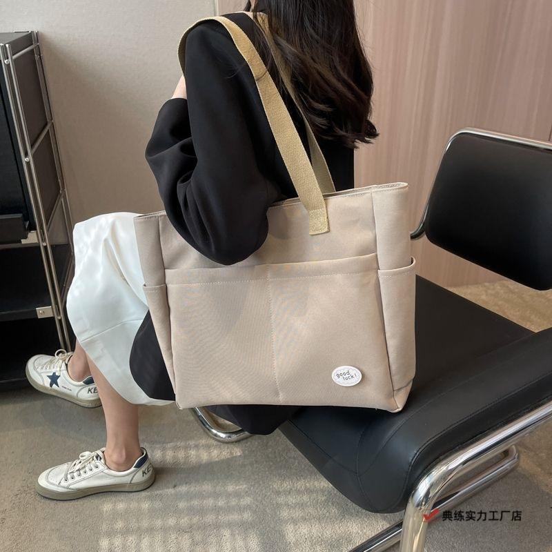 Large capacity lazy wind canvas bag women's solid color niche shoulder handbag casual versatile commuter tote bag