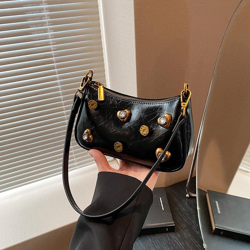 Woman Bags bag 2025 new Korean version of fashion rivets personalized trend women's shoulder crossbody armpit bag