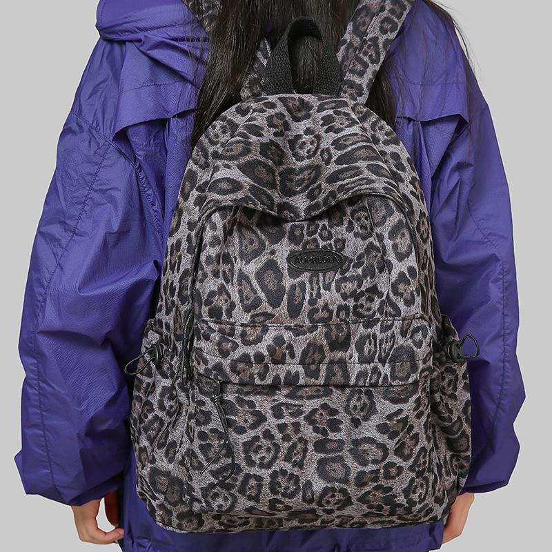 New backpack personalized leopard print versatile portable fashion middle school student schoolbag women's high-end niche backpack