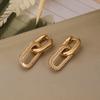 Goldfarbene Hängeohrringe mit glänzendem Zirkon-Dekor Elegantes minimalistisches Doppelschleifen-Design Creolen Schmuck Geschenk für Frauen