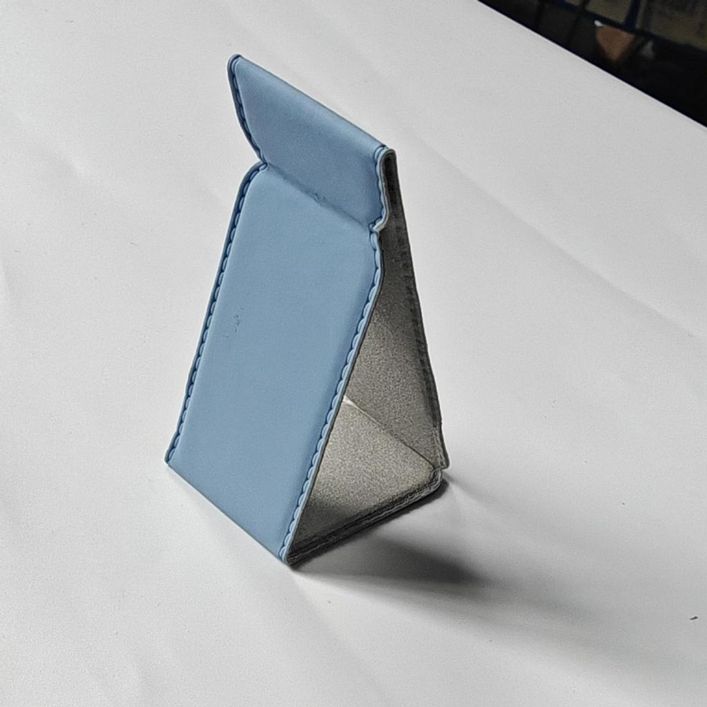 Universal PU Leather Phone Stand: Magnetic, Stick-On Holder for Foldable Android, Apple, and Huawei Devices
