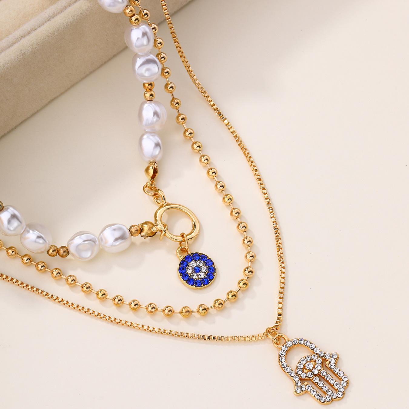 

Layered Faux Pearl & Cubic Zirconia Necklace for Women, Gold-Tone Zinc Alloy Hamsa Hand & Evil Eye Pendant золотий жовтий колір