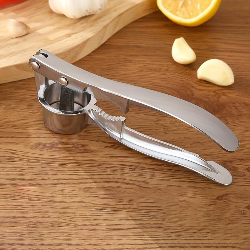 Durable 2-in-1 garlic press and nutcracker - High-Quality Manual Garlic Press Easily chops and peels Very suitable for home cooking Essential