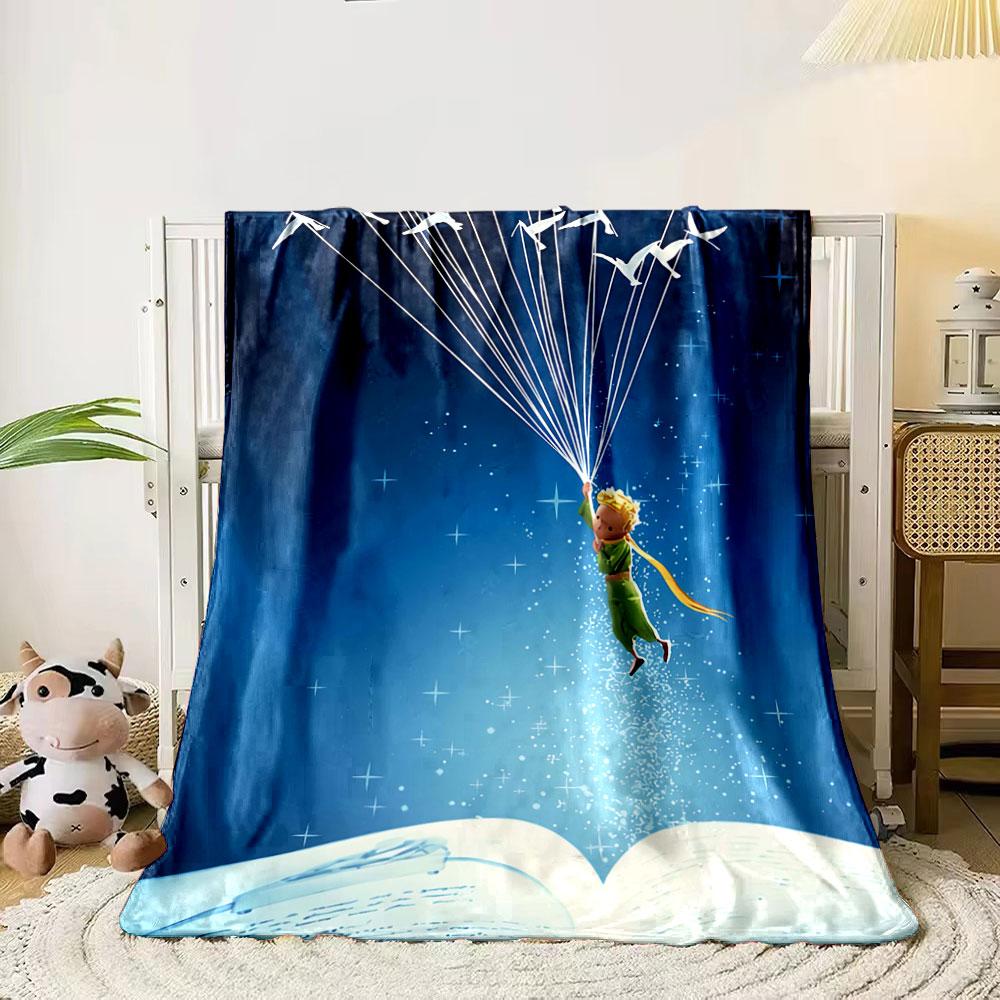 Un ragazzo fluttua con uccelli e fili sopra un libro aperto in un cielo stellato. coperta per tutte le stagioni coperta per pausa pranzo regalo