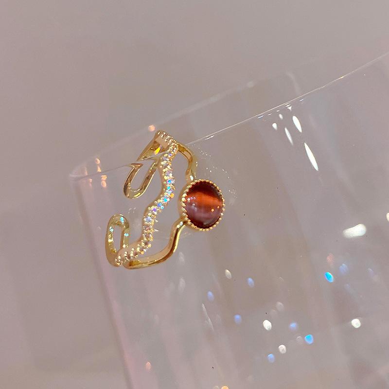 Electroplated Korean artificial opal zir*****pen ring, a sexy index finger ring jewelry.
